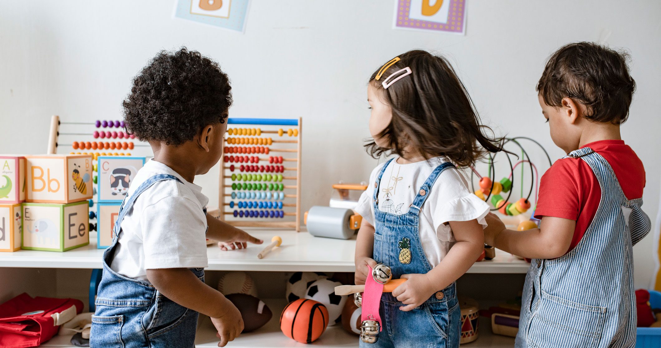 Preschool children playing with educational toys.